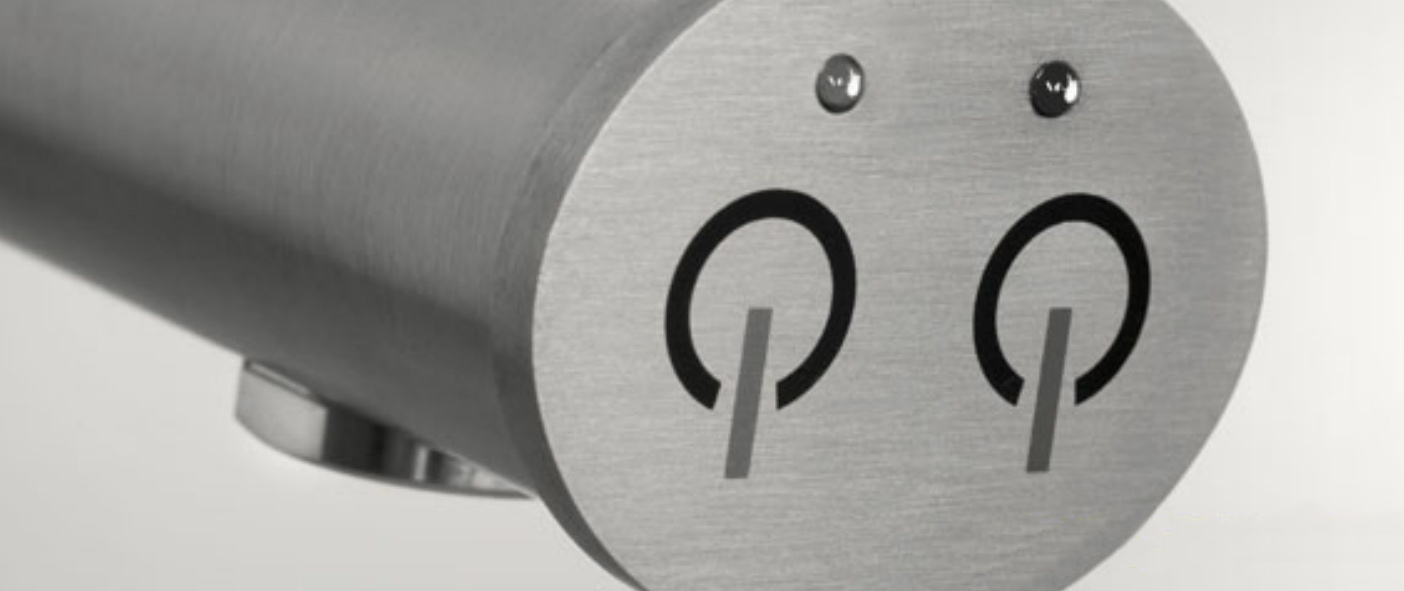 Figure 3: The overlay of a piezoelectric touch panel can be any material, including stainless steel, as used for the ‘hot’ and ‘cold’ waterproof controls on this mixer tap.